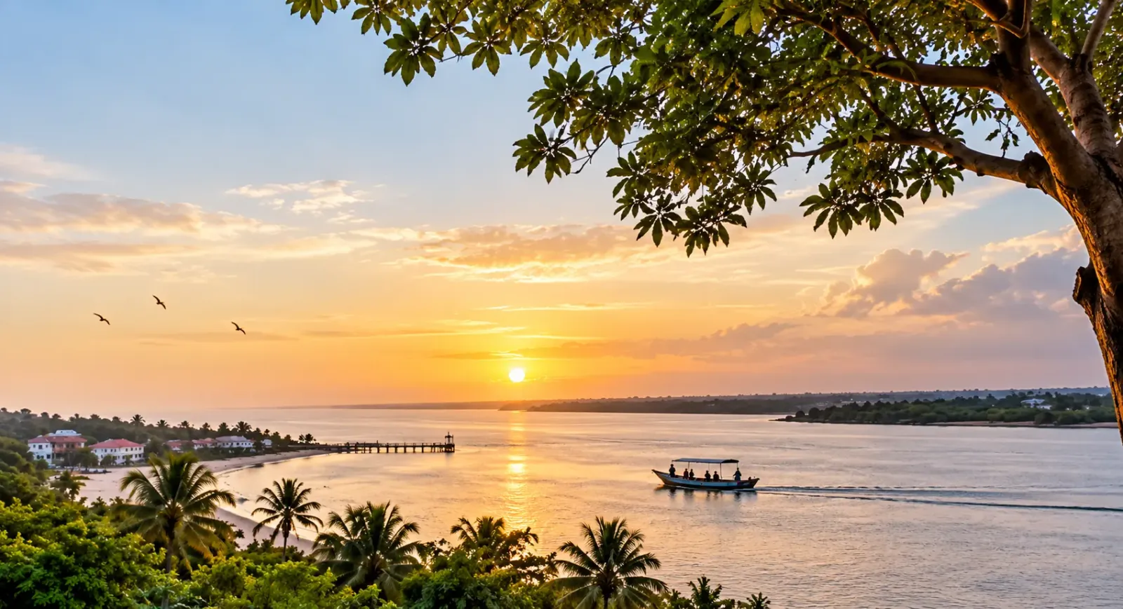 A panoramic view of The Gambia featuring the River Gambia at sunset, tropical scenery and a traditional boat, reflecting the country’s natural beauty, culture and connection to the river.