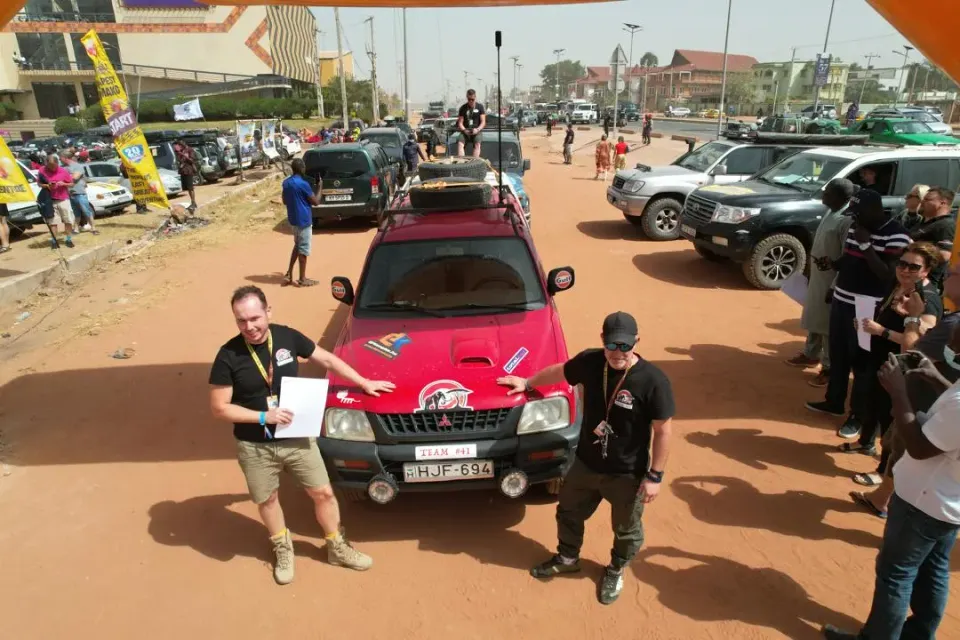 Budapest–Bamako Rally participants arriving at the finish line in Senegambia, The Gambia, marking the conclusion of their international journey.